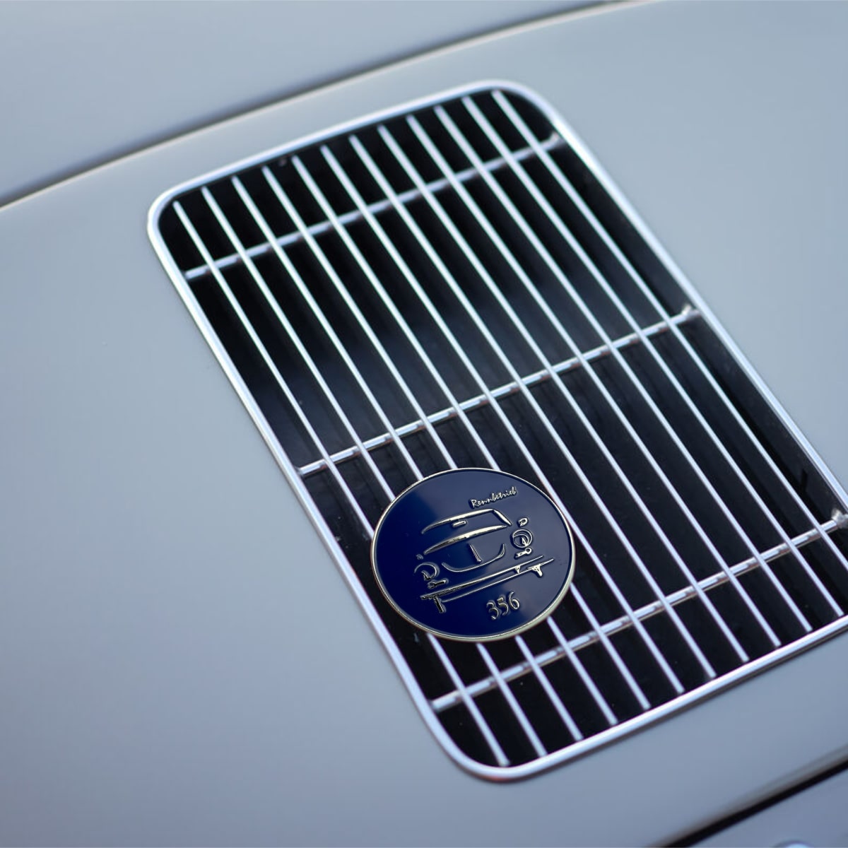 porsche 356 badge on blue porsche 356