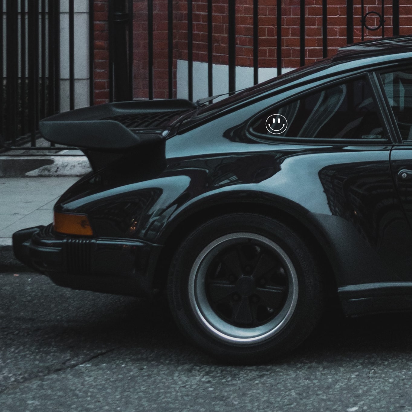 porsche 930 turbo with smiley sticker by rennbetrieb