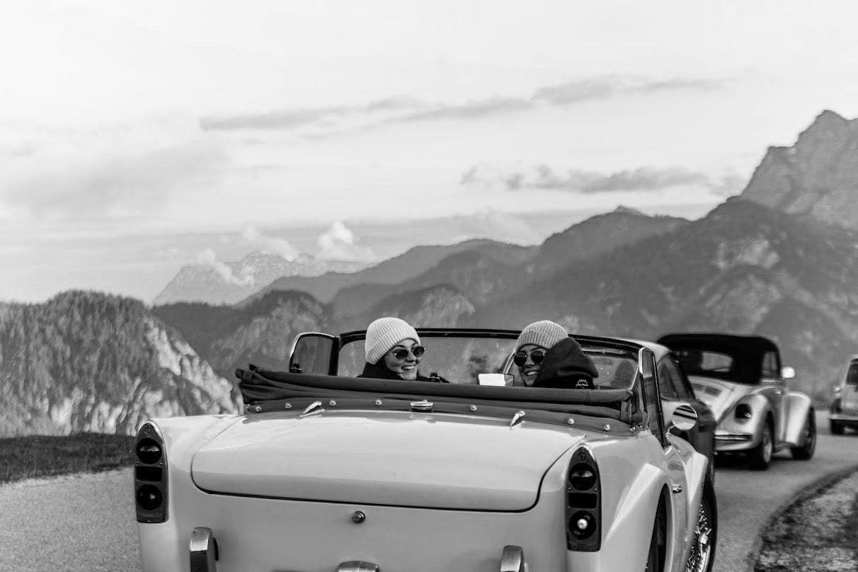 two girls sitting in an daimler 250sp