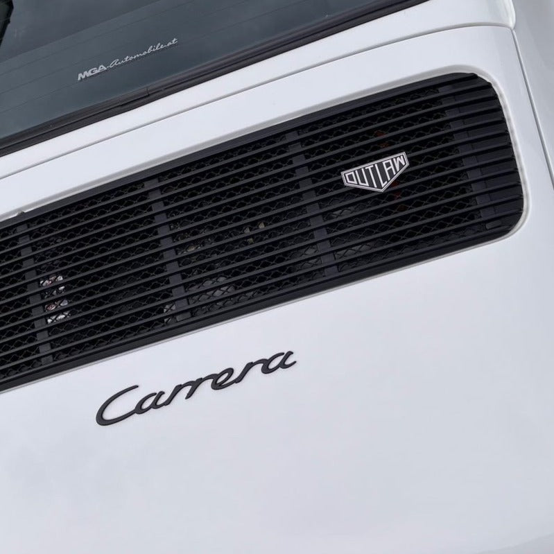 rennbetrieb outlaw badge on white porsche 911
