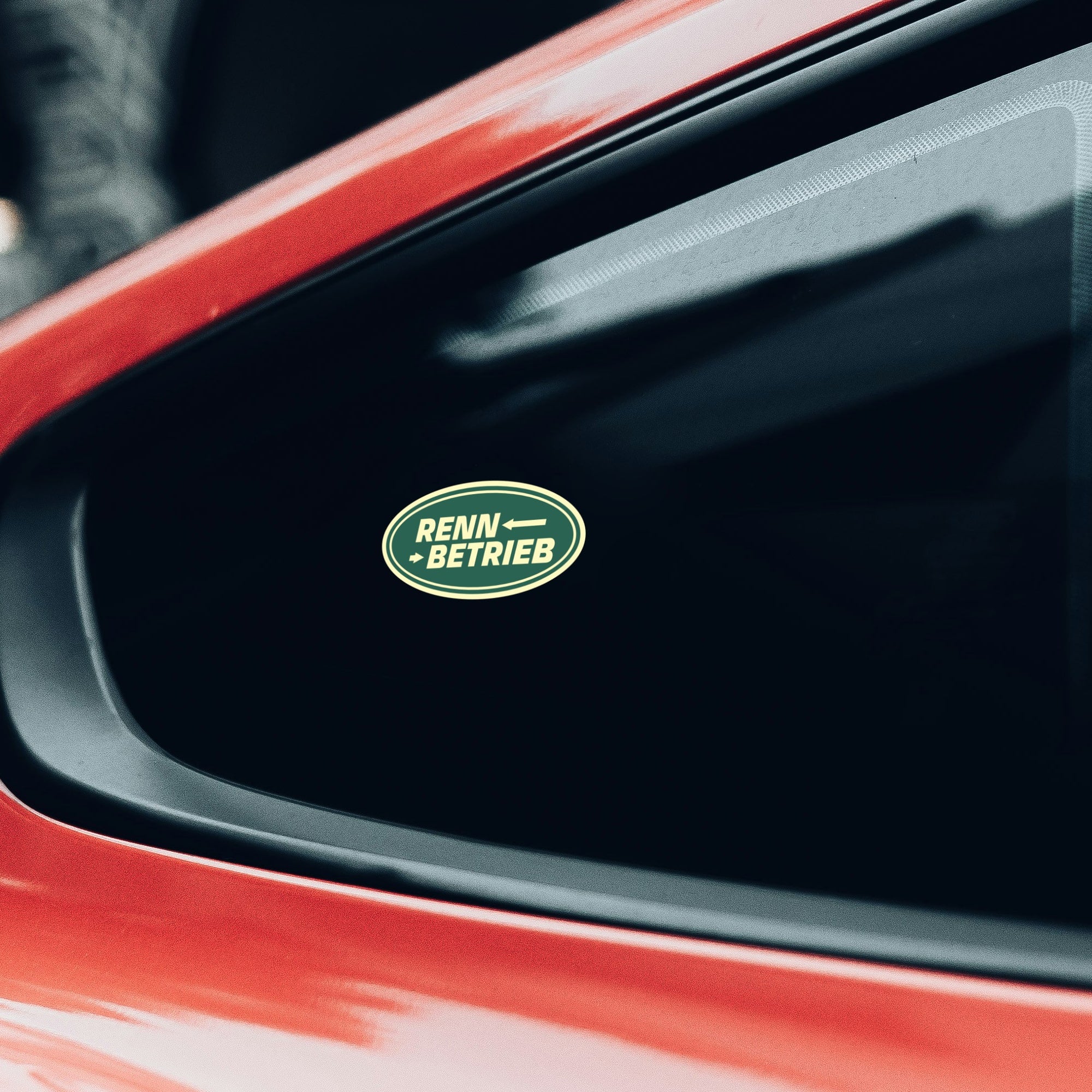 rennbetrieb sticker on red porsche