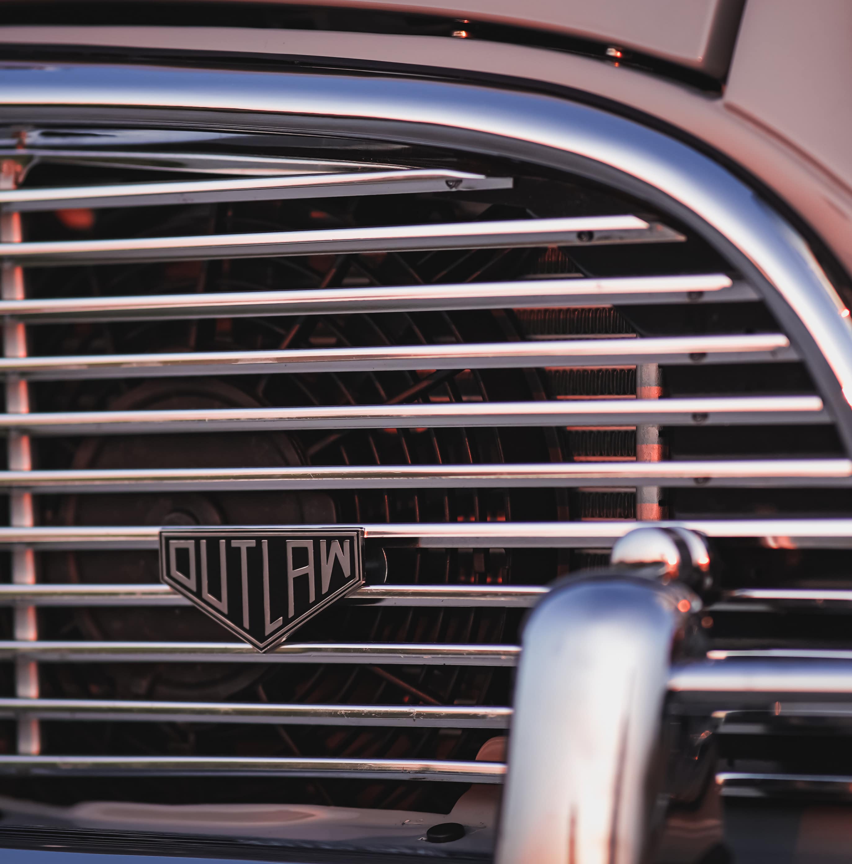 rennbetrieb outlaw enamel badge on mini cooper