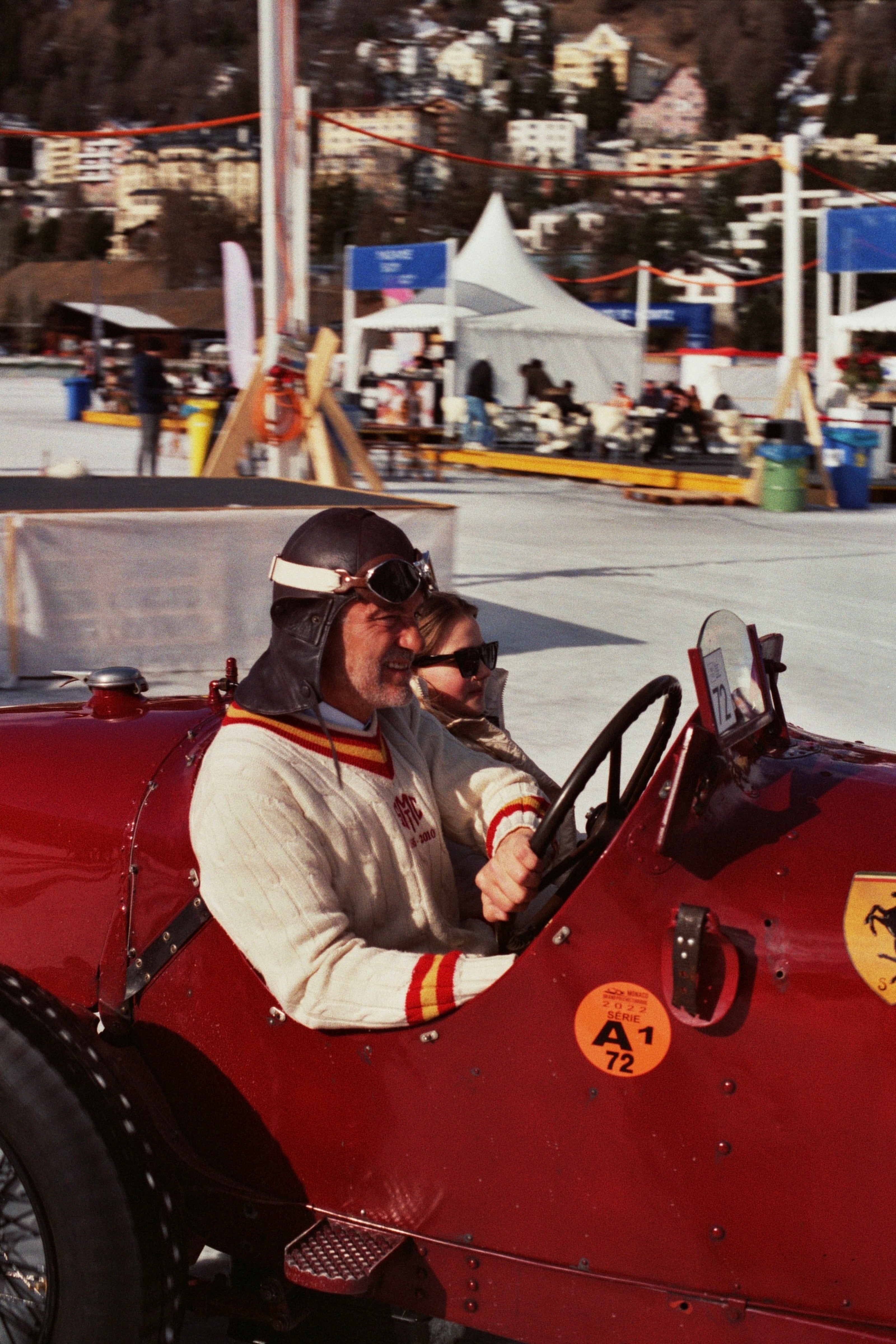 man sitting in vintage ferrari at the ice st moritz