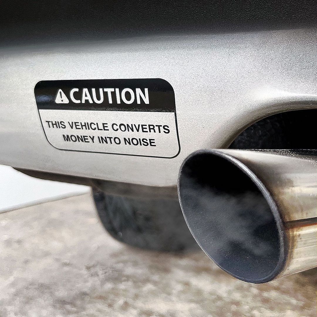 caution this vehicle converts money into noise