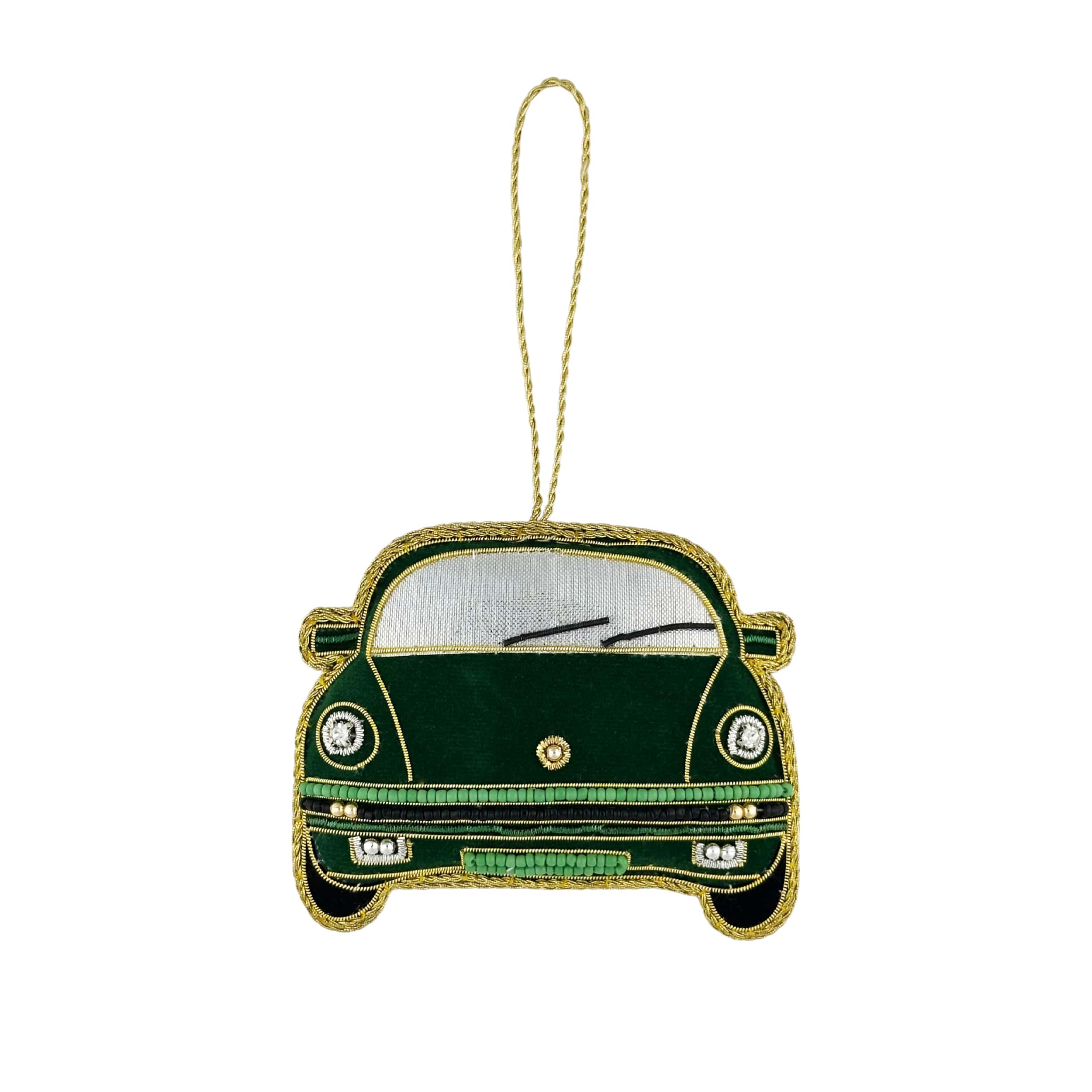 Green car-shaped ornament with gold accents on a white background