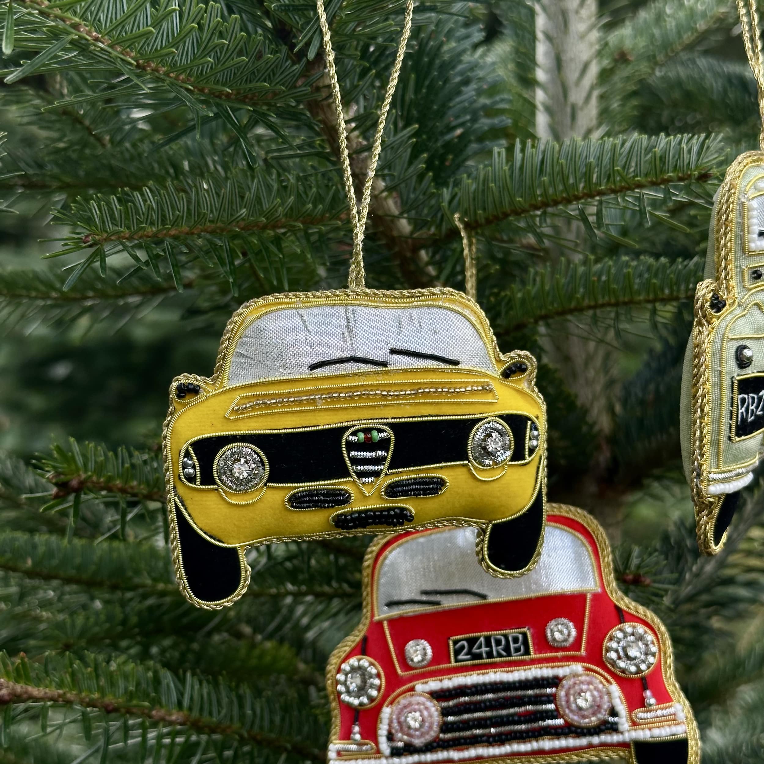 Decorative car ornaments on a Christmas tree