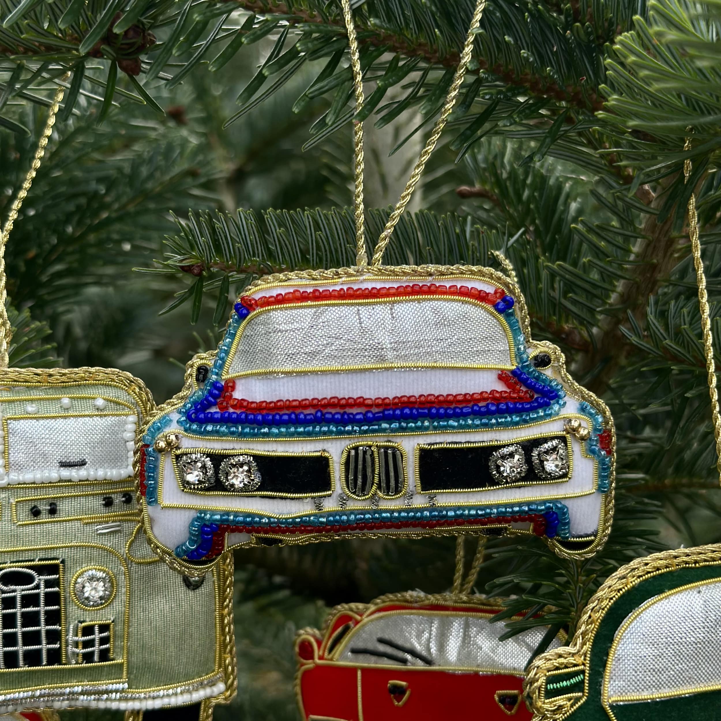Decorative car ornaments on a Christmas tree