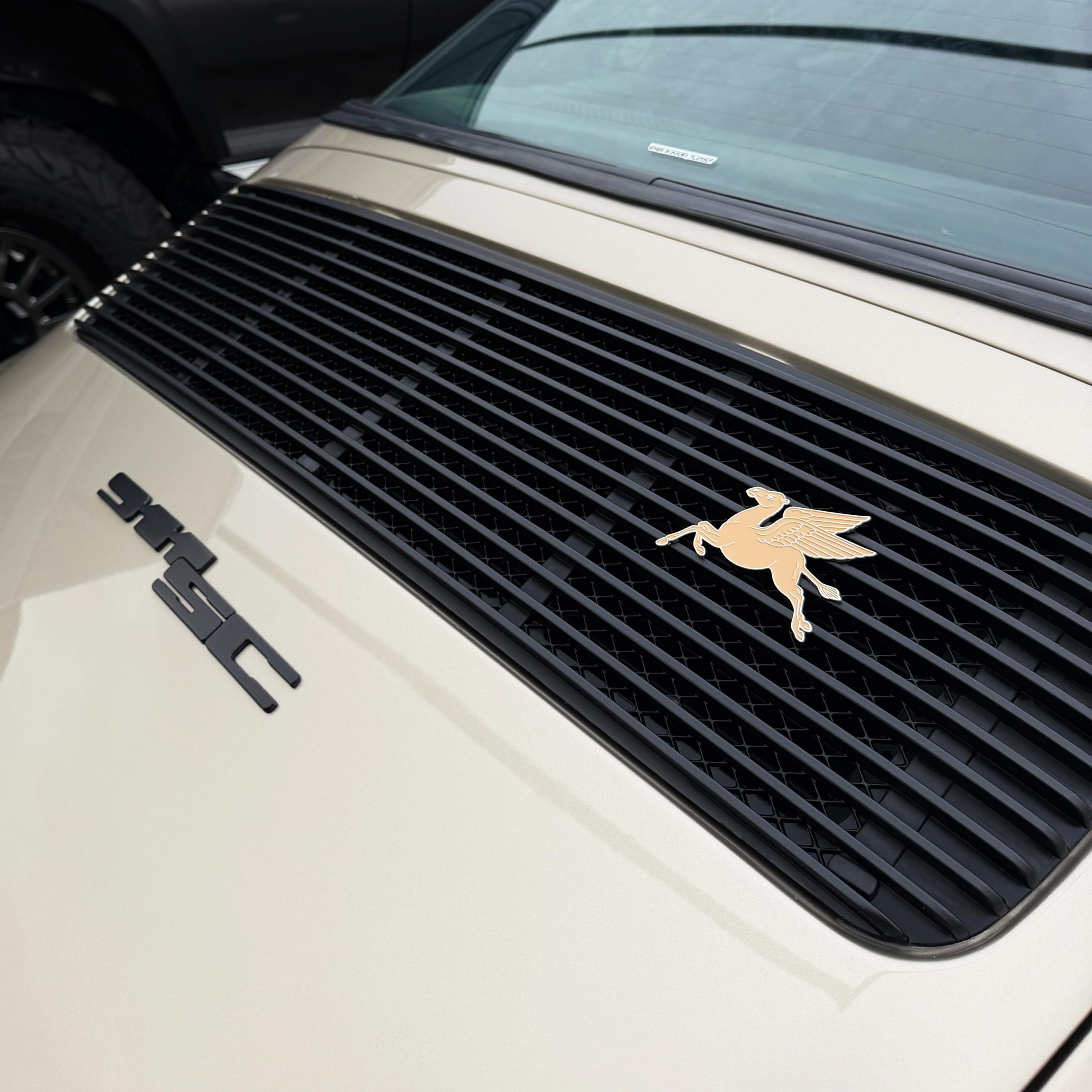 camel pegasus on porsche badge