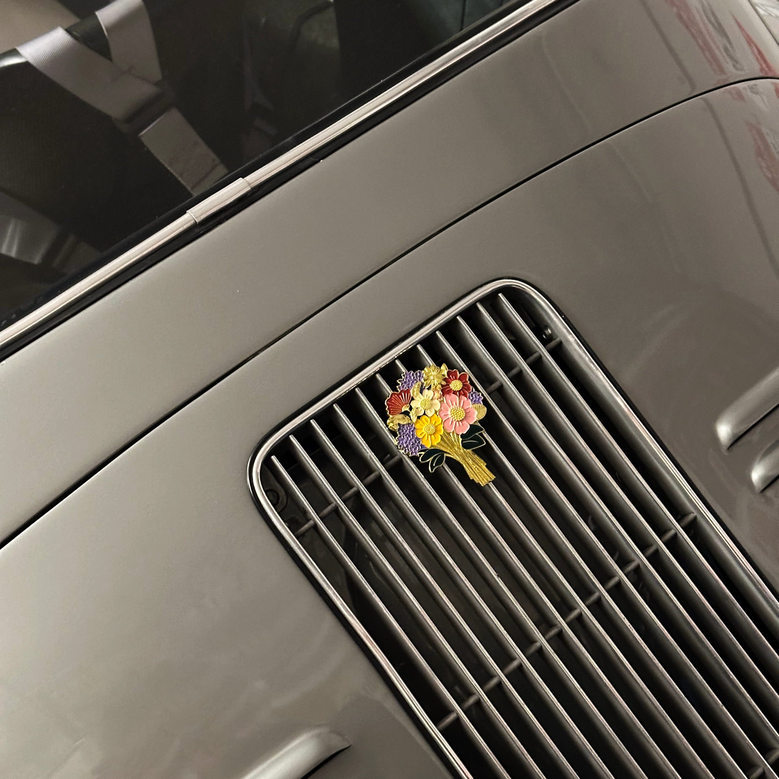 floral enamel car grill badge on porsche 356