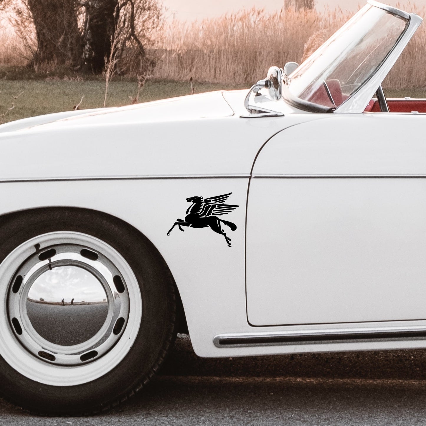 white porsche 356 speedster with pegasus sticker