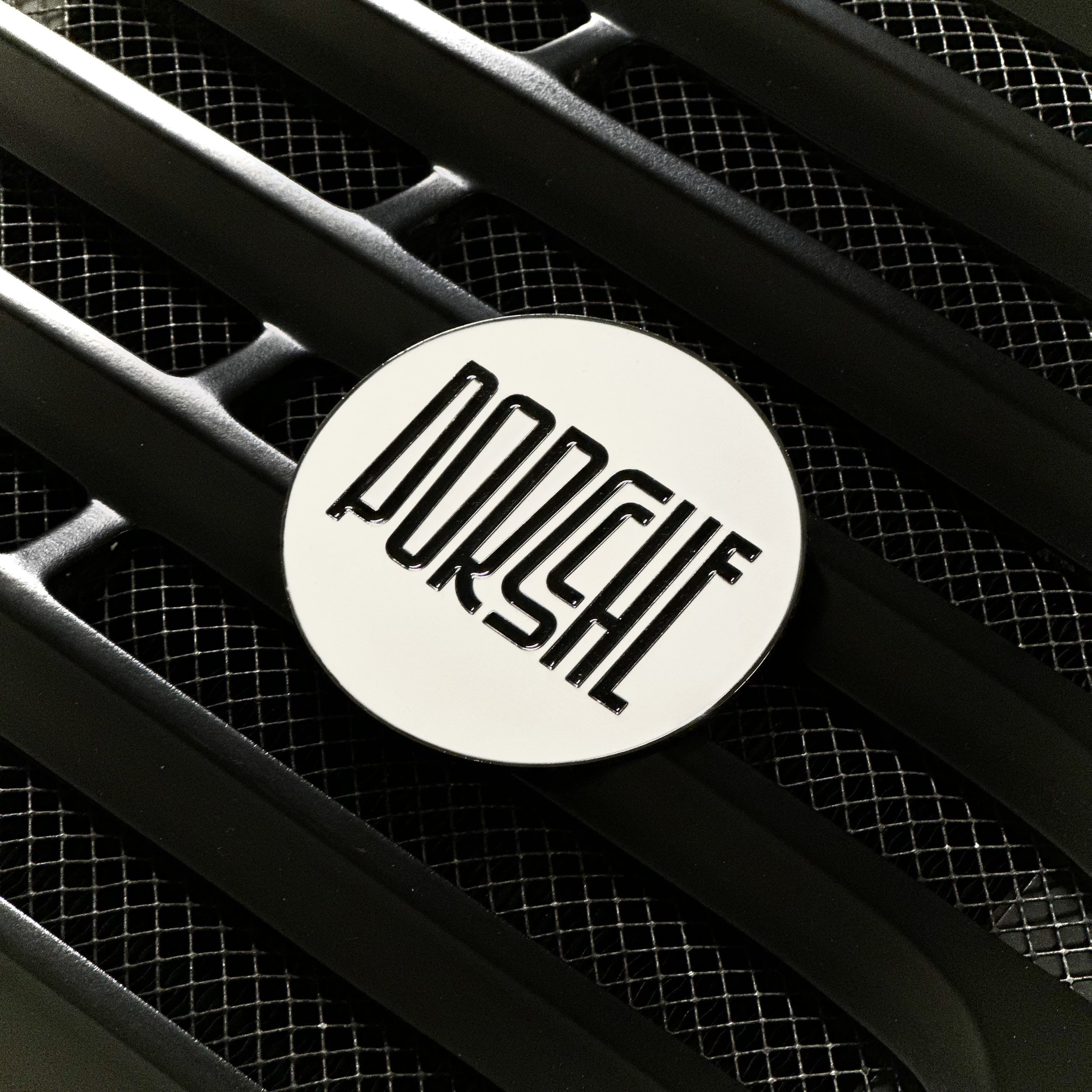 rennbetrieb white enamel badge on porsche