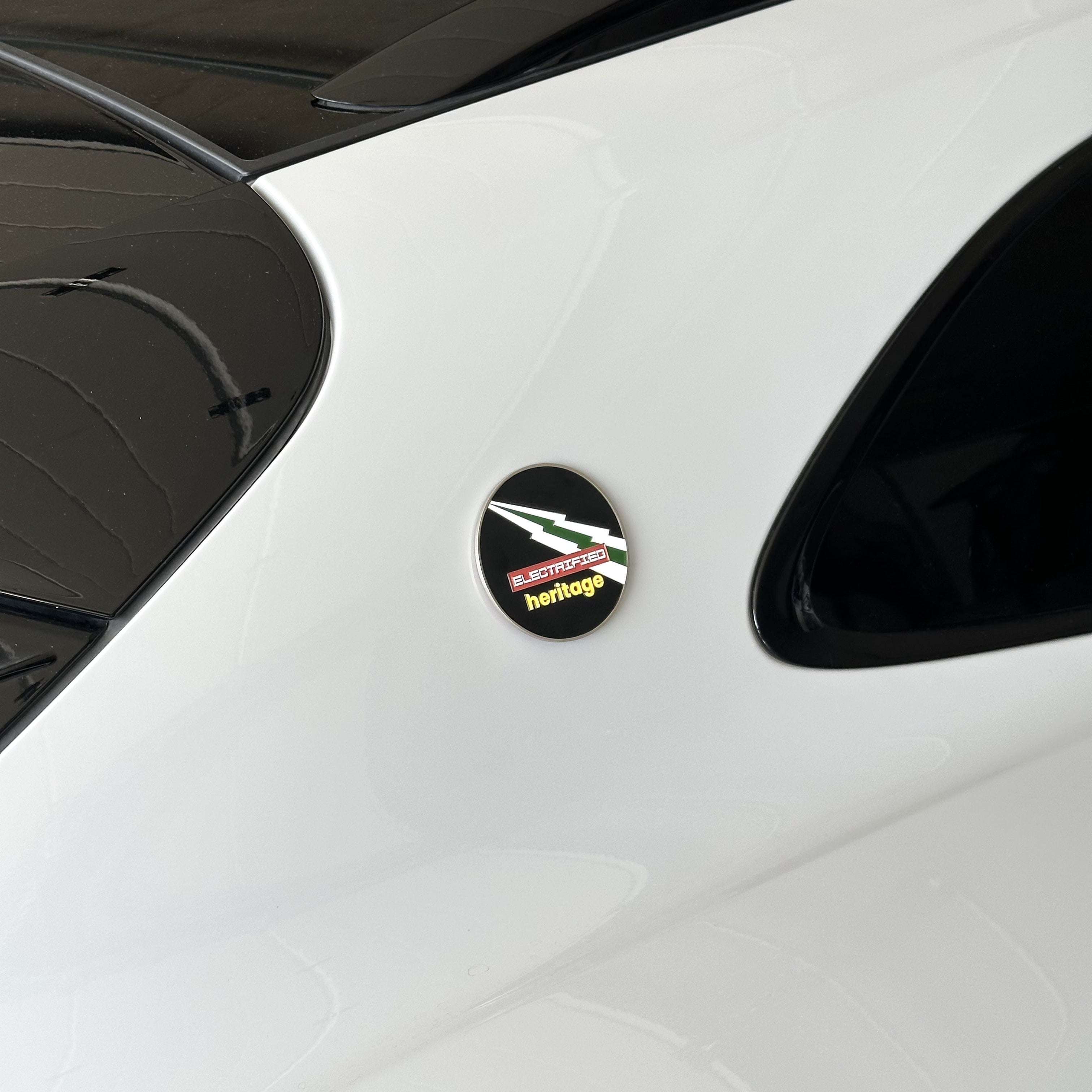 electrified heritage porsche enamel badge on porsche taycan
